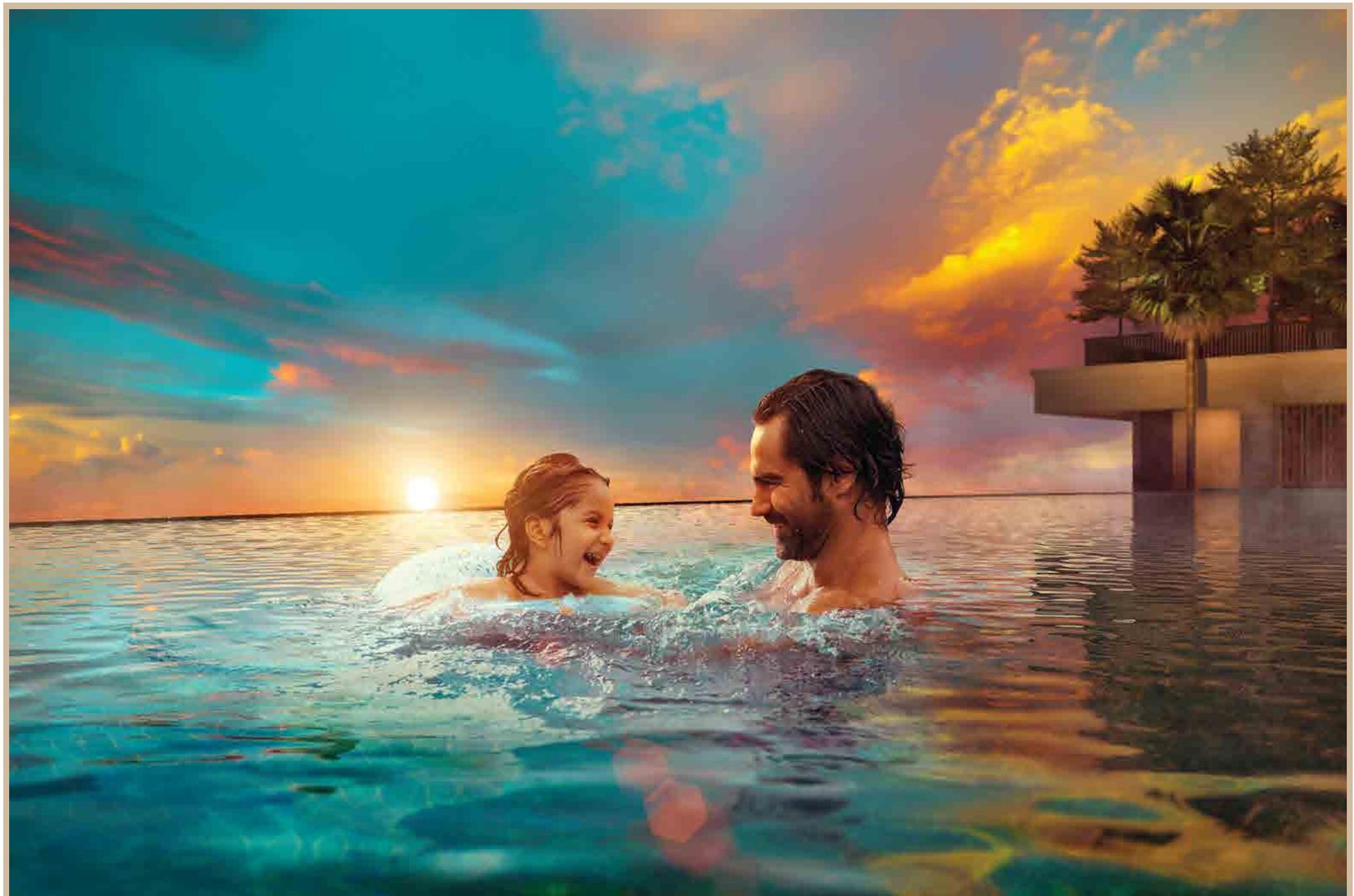 Adults pool at Mahindra Vista with the towers behind at sunset